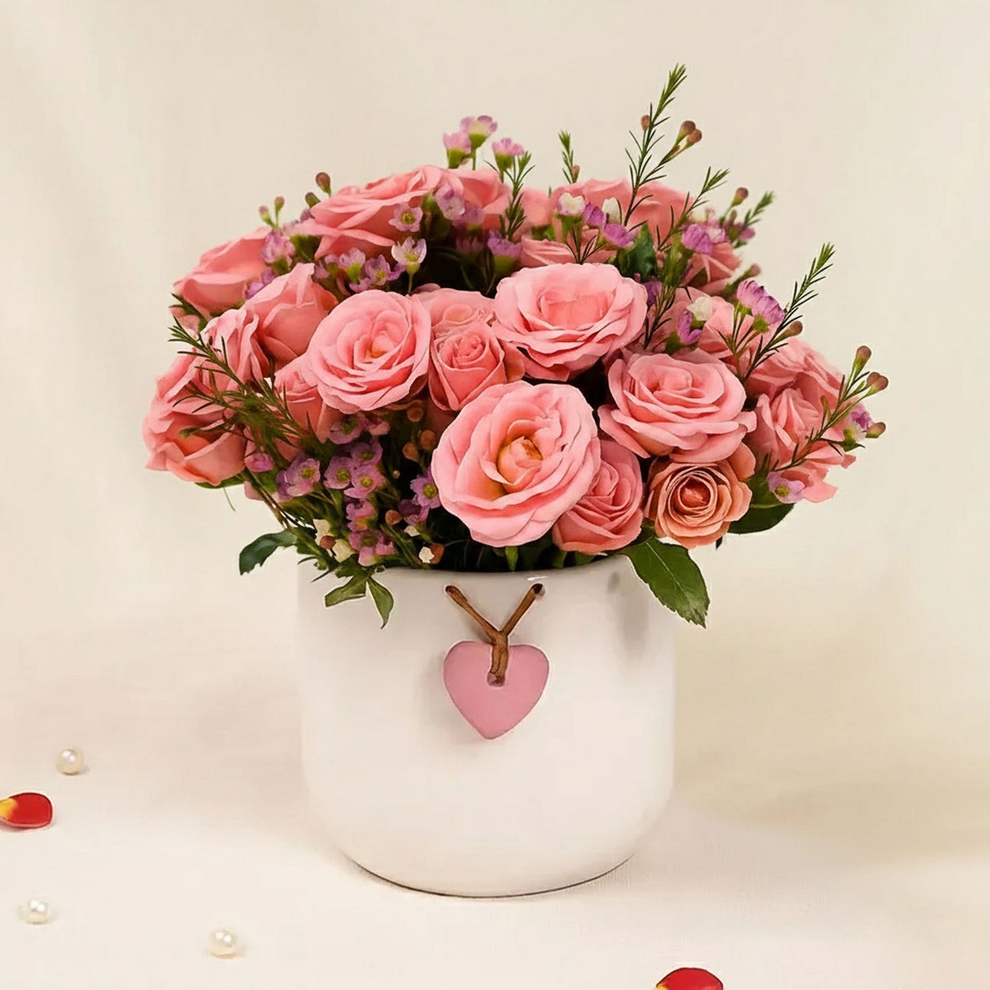 Pink Perfection Blooms Roses in White Heart Vase